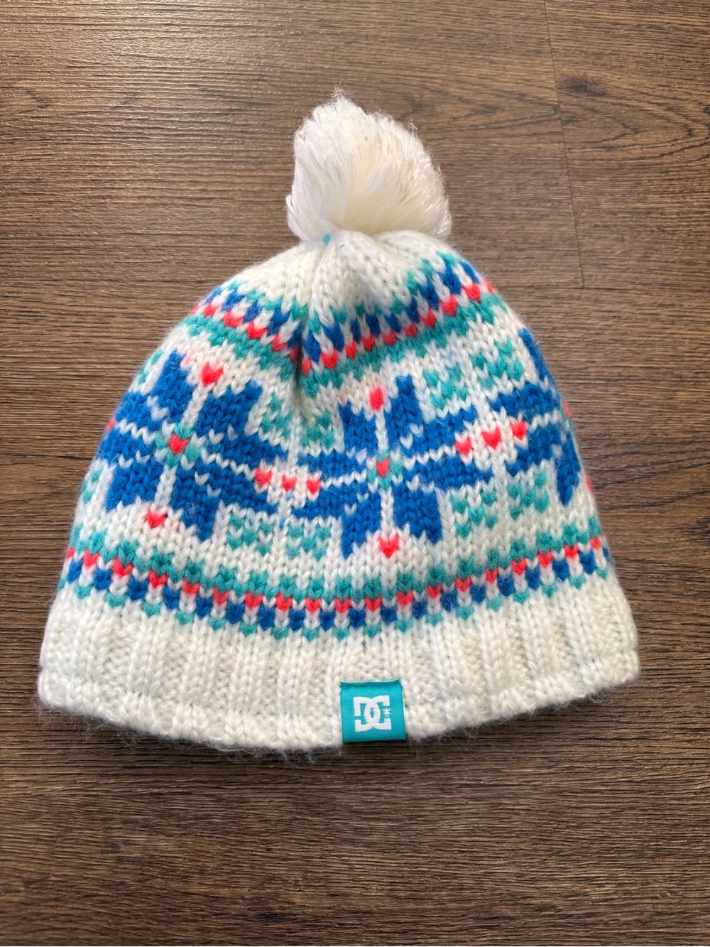 DC Cream Knit Pom Beanie with Blue and Teal Snowflake Motif